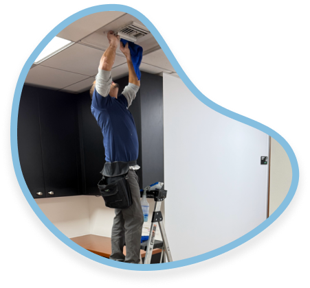 Janitors OC technician performing post construction vent cleaning in Orange County